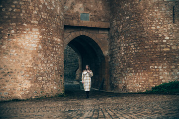 Girl in front of the entrance gate of the old city in Luxembourg - obrazy, fototapety, plakaty