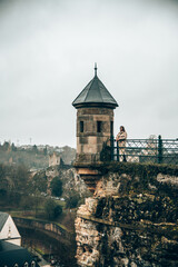 Woman next to a tower with a viewpoint in Luxembourg center