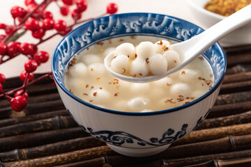 Little white tangyuan with sweet osmanthus honey and syrup soup.