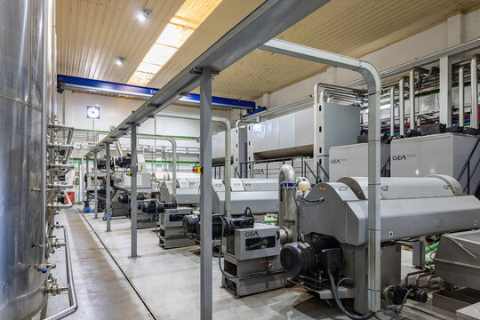 Huelva, Spain - December 4, 2022: Inside of an olive oil mill. Extra virgin olive oil factory by cold centrifugal  extraction, brand Olibeas in the village of Beas, Huelva province,  Andalusia, Spain