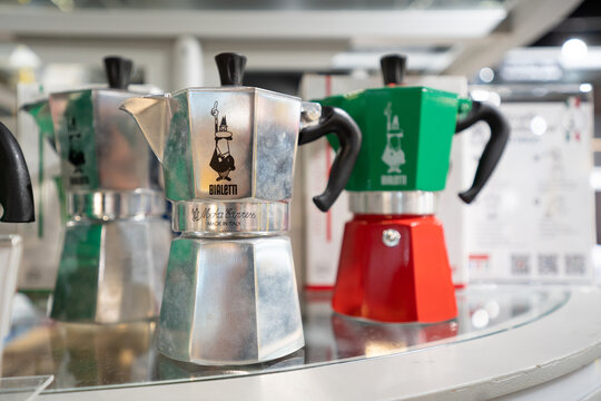 BANGKOK, THAILAND - AUG 10, 2022: Various size of Bialetti Moka pot coffee maker on the shelf in the Loft Bangkok.