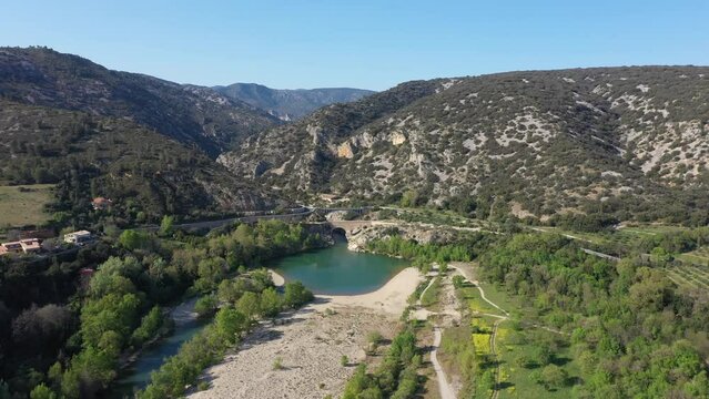 Aerial back traveling over Pont du diable beach UNESCO World Heritage Site sunny spring