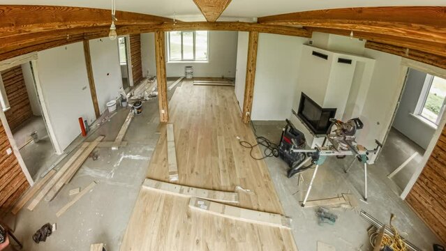 Installing hardwood flooring in a rustic, new home or cabin - time lapse