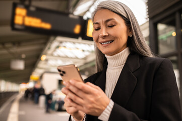 Long-haired woman on the platform in a subway