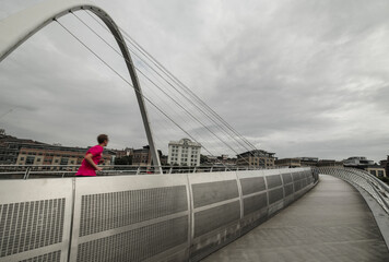 Jogger on Millennium Bridge Gatehead.