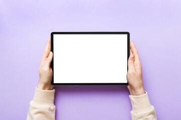 female teen hands using tablet pc with white screen, Mockup image of woman hand holding white tablet pc with blank white screen at home
