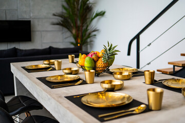 modern kitchen with appliances. Subtle lighting. dining table made of polished concrete