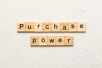 Purchase power word written on wood block. Purchase power text on cement table for your desing, concept
