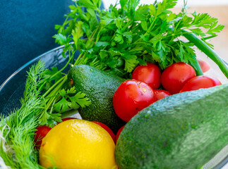 Vegetables on a white plate. Tomatoes and avocados.
