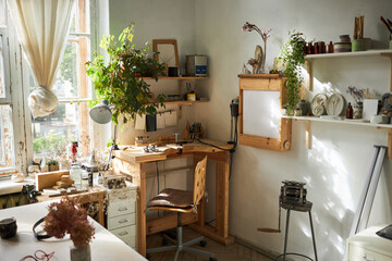 Background image of cozy workshop studio lit by sunlight with wooden details, copy space