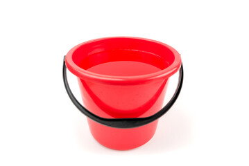 Plastic bucket with water on white