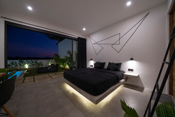 modern stone pine bed with red led lighting, wall lamps. Bedroom in luxury loft apartment - shot in...