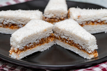Coconut Cookies. Hazelnut cookies with honey on a gray background. Cookies with coconut and hazelnut filling. close up