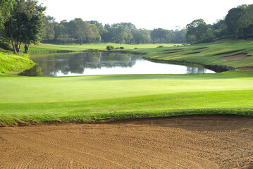 The beauty of the golf course is its bunkers and ponds.