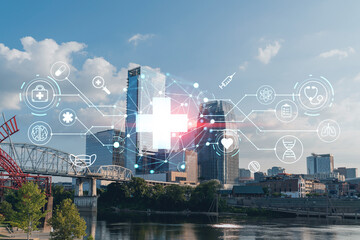 Panoramic skyline view of Broadway district of Nashville over Cumberland River at day time, Tennessee, USA. Hologram healthcare digital medicine icons. The concept of treatment from disease