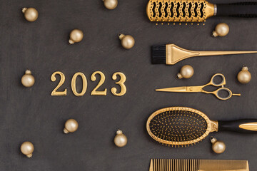 New years banner with hairdressing tools, Christmas balls and numbers 2023. Gold and black hair...