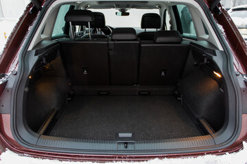 Huge, clean and empty car trunk in interior of compact suv. Rear view of a SUV car with open trunk