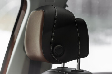 Leather car seats close up view. Modern Car Interior details. Leather headrest.