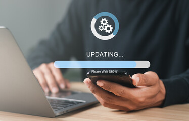 Businessman working and installing update process. Software updates or operating system upgrades to...