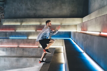 Fototapeta na wymiar Man climbing stairs in gym