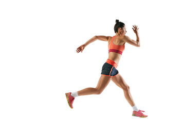 Dynamic portrait of professional female athlete, runner or jogger wearing summer sportswear running...