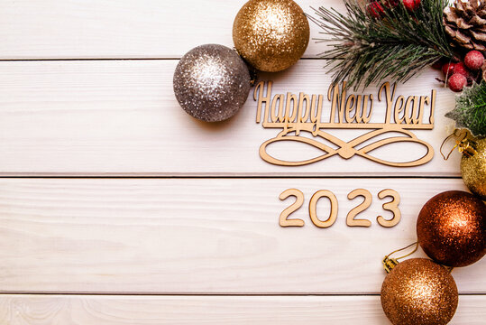 Happy new year 2023 on wooden white background
