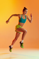 One sportive girl in sports uniform isolated over yellow background. Concept of sport, beauty,...