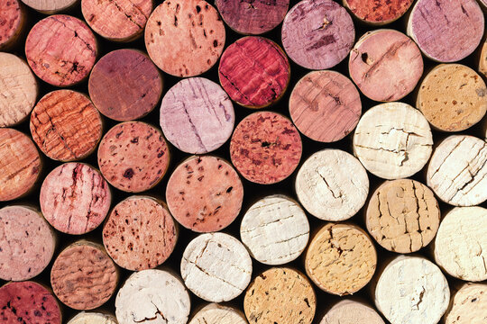 Collection of wine cork from white and red wine, natural texture bottle stoppers top view, colorful background from closeup wooden corks. Natural textured stoppers Winery, winemaking concept