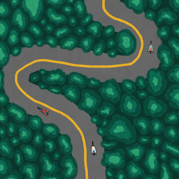 Cyclists driving on curvy road