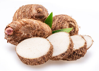Eddoe or taro tubers and its slices isolated on white background.