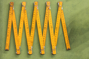 Folding ruler on green table