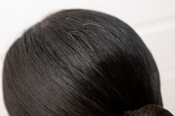 Close-up  hoary hair on woman head , health care concept
