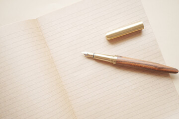  old empty paper and fountain pen on table 