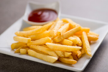 Potatoe fries with tomato sauce served in dish isolated on grey background top view of arabic food