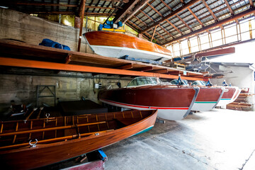 Vinage wooden motor boats in shipyard