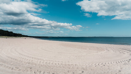 Fototapeta na wymiar Beautiful white sand beach in Ystad, Sweden. Popular tourist destination.