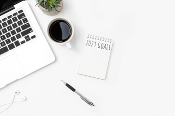 Notebook with 2023 goals text on it to apply new year resolutions and plan.