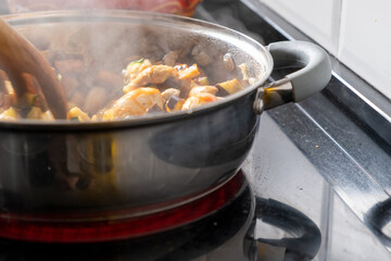 pan cooking vegetables on fire
