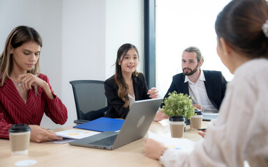 Group of business people meeting as planning and discussing project in workplace.