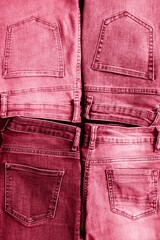 Fashion collection denim jeans in viva magenta color. Creative jeans background. Top view, flat...
