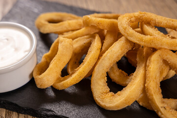 Deep fried calamari rings, squid rings with sauce