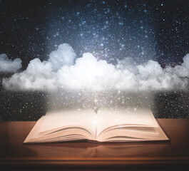 Open book with space and clouds. Fairy tale concept.