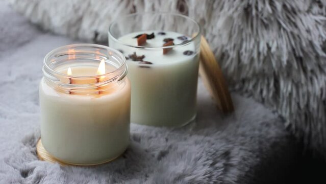 Beautiful handmade candles. A candle is burning. Cozy atmosphere in the house. Background video