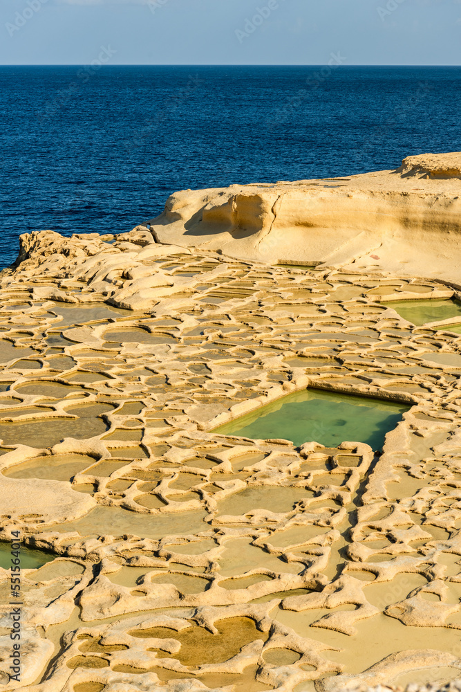 Wall mural Traditional salt pans in Xwejni Bay on the island of Gozo, Malta.