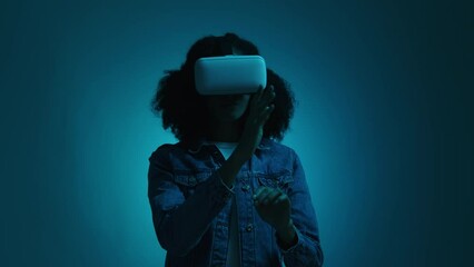 Close-up shot of young woman in virtual reality glasses. Astonished girl having augmented reality tool. High quality 4k footage