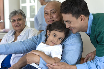 Young girl visiting grandma and grandpa at nursing care,  Senior Care concept
