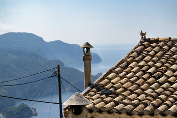 mediterran roof in front of the mountainous coast of corfu