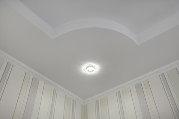 suspended ceiling with halogen spots lamps and drywall construction  with intricate crown molding...