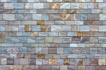 colored stone wall texture. Granit stonewall background 