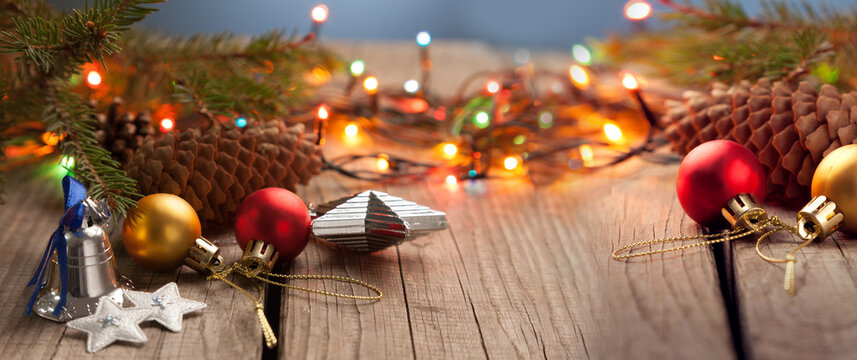 Christmas ornaments on a table with nice festive background Xmas illuminations